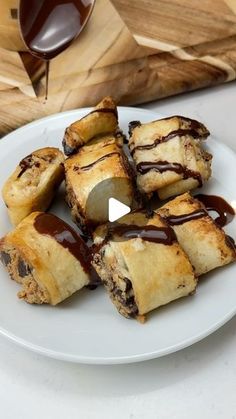 a white plate topped with chocolate covered pastries