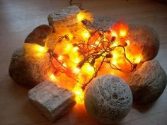 some rocks with lights on them sitting on the floor