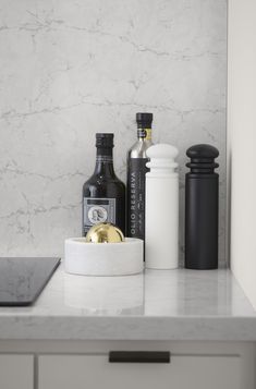 some bottles are sitting on a counter top