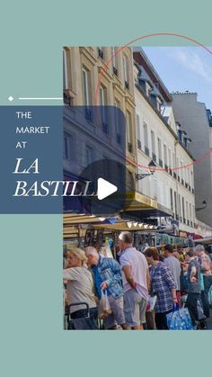 the market at la bastill is full of people walking through it and there are buildings in the background