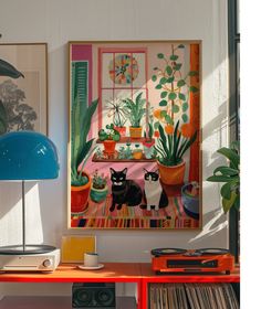 there is a painting on the wall next to a desk with a lamp and record player