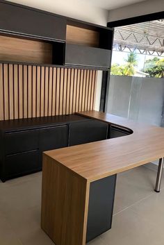 an office desk and cabinets in a room