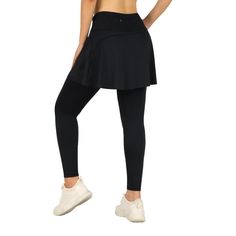 the back view of a woman in black sports bra top and high waisted leggings