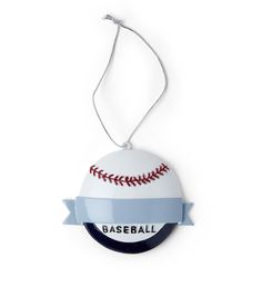 a baseball ornament hanging on a white wall with a ribbon that says base ball