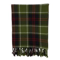 a green and black plaid blanket with fringes