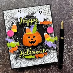 a halloween card with a pumpkin and candy on it