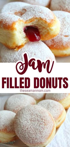 jam filled doughnuts on a plate with powdered sugar and jelly in the middle