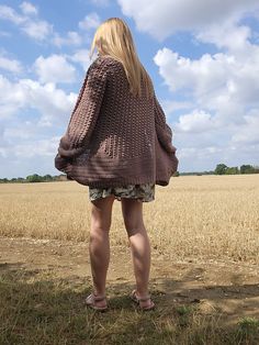 A hexagon crochet cardigan worn by a woman.