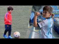 two boys are playing soccer in front of an empty bleachers and one boy is holding a ball