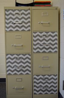 an old filing cabinet with chevron drawers in the middle of a school gym room