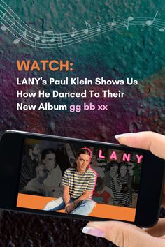 someone is holding up their cell phone to take a photo with the text, watch lany's paul kiln show us how he dances to their new album