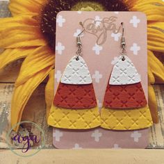 Faux leather earrings never looked so yummy. But don't eat them. It's candy corn in its most wearable state. Three separate layers of cross cross embossed faux leather have just the right amount of shimmer for everyday fall wear. Fall Faux Leather Earrings Embroidery, Faux Leather Earrings Fall, Fall Earrings Cricut, Faux Leather Fall Earrings, Faux Leather Halloween Earrings