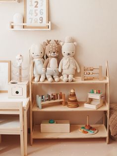 there are many stuffed animals on the shelves in this child's playroom with toys