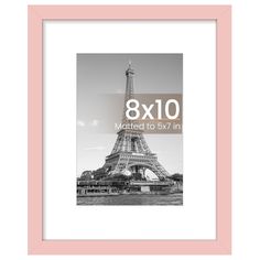 the eiffel tower in black and white with pink border is shown against a light pink frame