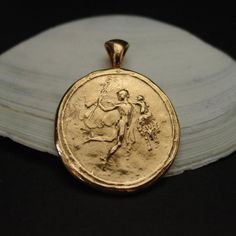 Handmade intaglio cameo pendant reproduction of Hermes God and his baby daughter Tyche ( Goddess Fortuna).This cameo represents Hermes carrying his baby daughter Tyche, Goddess of Good Fortune and Prosperity.Hermes is considered the herald of the gods. He is also the protector of human heralds, travellers, thieves, merchants, and orators. He is able to move quickly and freely between the worlds of the mortal and the divine, aided by his winged sandals. He is also a trickster god as he likes his Hermes Cabin Headcanons, Greek Mythology Hermes, Hermes Mythology, Hermes Tattoo, Goddess Fortuna, Hermes God, God Mercury, Hermes Necklace, Rome Antique