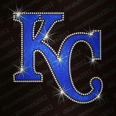 the letter k is made up of blue glitter and sparkles with white stars on it