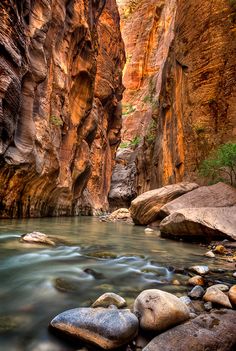 a river flowing through a canyon surrounded by rocks