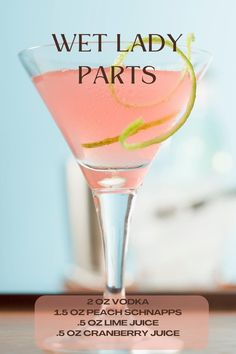 a pink cocktail in a martini glass with lime garnish on the rim and text that reads wet lady parts