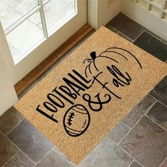 a door mat that says football all over the floor with an image of a football on it