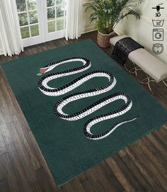 a green rug with a snake on it