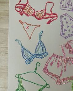 an image of some bras and panties on a piece of paper that is drawn with colored crayons