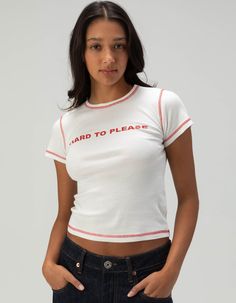 Bdg Urban Outfitters Hard To Please Baby Tee. "hard To Please" Screened Across Center Chest. Contrast Stitching. Ribbed Crew Neckline. Short Sleeve. 100% Cotton. Machine Wash. Imported. Model Is Wearing A Size Small. Model Measurements:height: 5'8" Bust: 32"waist: 24"hips: 35" Urban Outfitters Cotton Tops With Text Print, Urban Outfitters Graphic Tee With Text Print, Urban Outfitters Baby Tee, Urban Outfitters Cotton Short Sleeve T-shirt, Urban Outfitters Cotton Screen Print T-shirt, Overalls Boys, Chino Pants Women, Wwe T Shirts, Graphic Trends