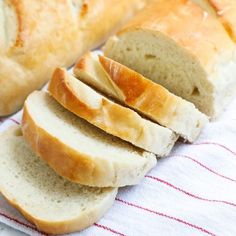 sliced bread sitting on top of a white towel