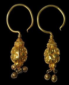 Pair of Gold Pendant Earrings China Liao Dynasty, 10-12th century height: 5.3cm, combined weight: 9g This pair of earrings decorated with geometric swirls in relief have been made by soldering together two sections of sheet gold. Hollow pendant spheres have been attached to the lower parts (three on one and two on another - the third presumably is missing). The earrings have large gold wire hoops. The pair is in a stable, wearable condition. References: Liu, Y. (ed.), Liaoning Museum, Chang Zhen Ancient Earrings, Liao Dynasty, Gold Pendant Earrings, Silver Gold Jewelry, China Jewelry, Ancient Jewelry, Japanese Antiques, Antique Earrings, Jade Pendant