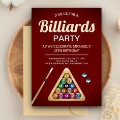 a birthday party card with billiards and pool balls on it next to a wooden plate