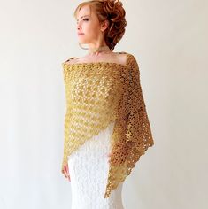 Gold Metallic Shawl Elevate your style with an elegant hand-crochet gold shawl at weddings or evening events. This sparkly wrap is perfect to complement any outfit. Moreover, this coverup is a wonderful gift. MATERİAL: 60% Metallic Polyester 40% Polyamide COLOR: Gold colored as shown AVAİLABLE COLORS: Gold and Silver MEASUREMENTS: Length: 78'' (200cm) Width: 39'' (100cm) CARE INSTRUCTIONS: * Hand wash * Use a mild, non biological detergent * Use a cool iron avoiding prints * Do not tumble dry * Elegant Gold Shawl For Gift, Elegant Gold Shawl Gift, Gold Shawl For Wedding And Festivals, Elegant Gold Dupatta As Gift, Elegant Gold Dupatta, Elegant Gold Shawl Dupatta, Elegant Handmade Wedding Dupatta, Formal Festive Gold Shawl, Elegant Handmade Shawl For Wedding