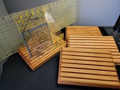 two wooden coasters sitting on top of a table