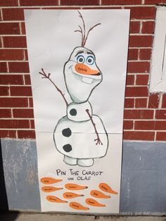 a frozen princess poster on the side of a building with words pin the carrot on olaf