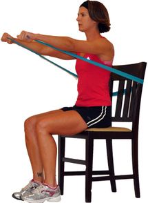 a woman is sitting on a chair doing squats with her arms stretched out to the side