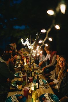 a group of people sitting around a dinner table