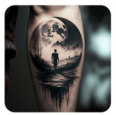 a man standing in front of a full moon tattoo on his leg with watercolor paint