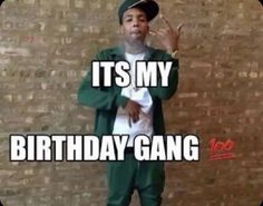 a man standing in front of a brick wall with the words it's my birthday gang