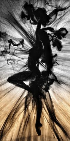 the silhouette of a woman dancing with her hair blowing in the wind, black and white photograph