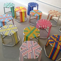 colorful chairs are arranged in a circle on the floor