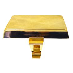 a gold and black metal object on a white background