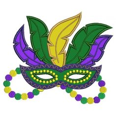 a mardi gras mask with beads around it's neck and leaves on top