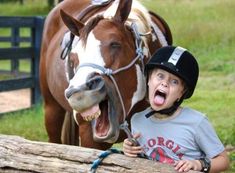 a young boy with his mouth open next to a horse and the caption happy birthday jw