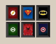 four framed pictures with different superhero logos on the front and back sides, all in various colors