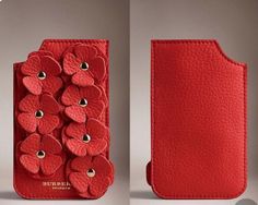 a cell phone case with red flowers on the front and back side, both in leather