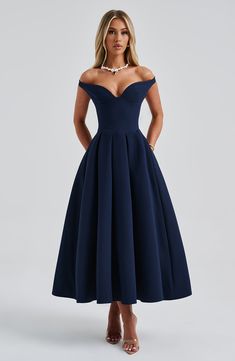 The epitome of elegance, Lanetta features a plunge bardot neckline with elasticated back strap bringing stylish flair. Falling to an effortlessly chic midi length, the design has a full, box pleated skirt and looks amazing paired with pointed heels and soft glam. 



Colour: Navy.

Premium non-stretch crepe.

Fully lined.

Plunge bardot neckline.

Shaped underbust seam.

Full, box pleated skirt.

Elasticated back strap.

Invisible zipper fastening.

Midi length.

 Size: XS, S, M, L, XL, XXL Box Pleated Skirt, Split Long Dress, Navy Blue Midi Dress, Bardot Neckline, Box Pleat Skirt, Vest Blouse, Loungewear Dresses, Maxi Dress Sale, Soft Glam