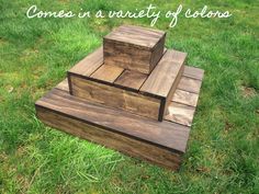 three wooden blocks stacked on top of each other in the grass with text that reads comes in 2 colors