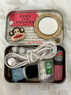 an open tin can with various items in it