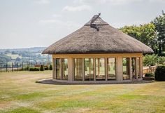 a gazebo in the middle of a grassy field