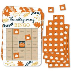 a board game with pumpkins and leaves on it