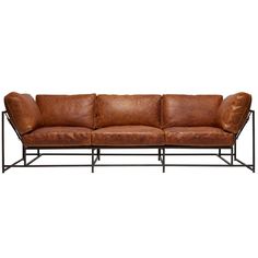 a brown leather couch with black metal frame