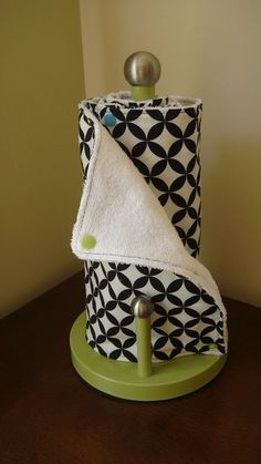 a black and white towel holder sitting on top of a table